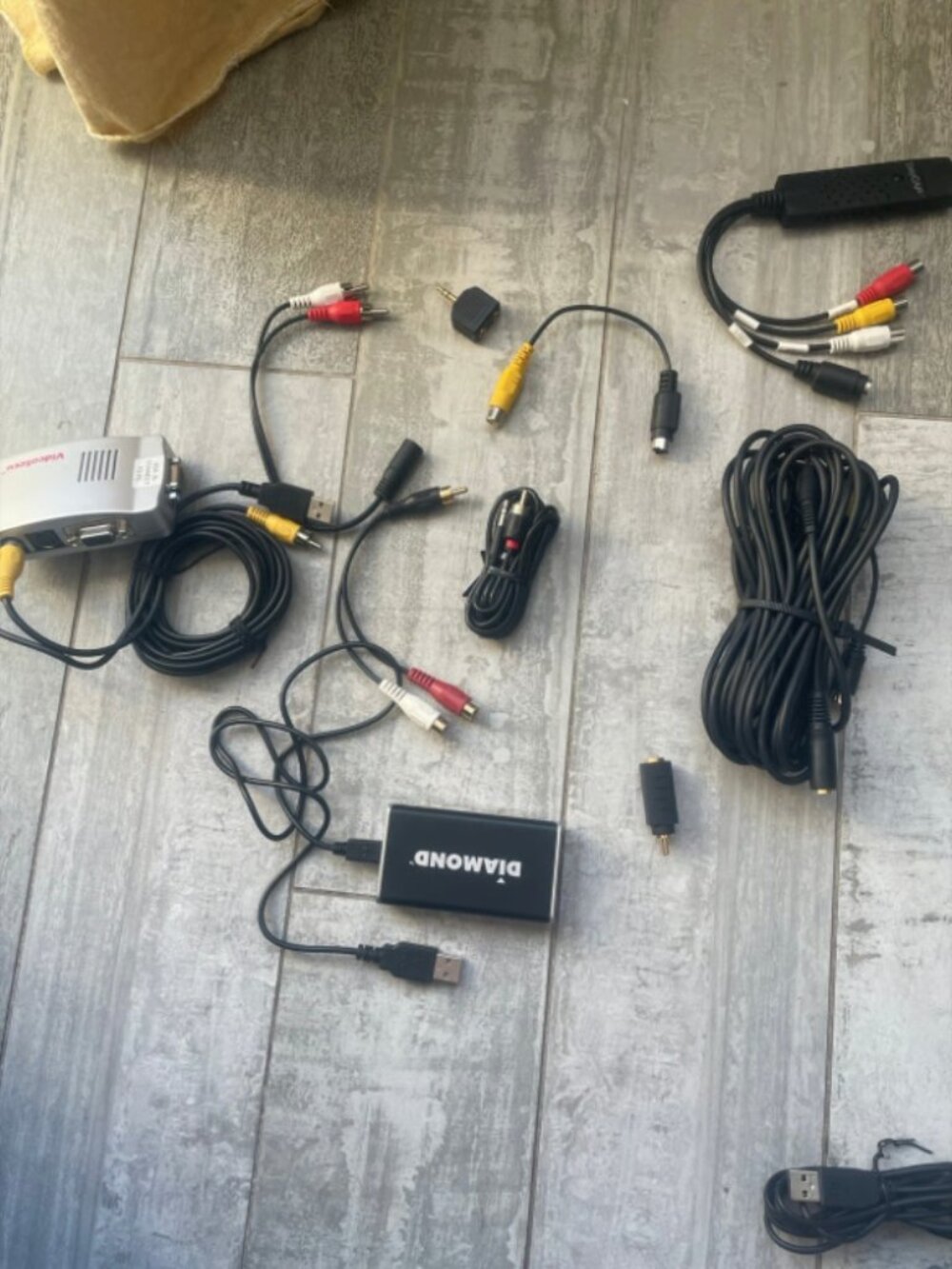 A bag of new like new or used cables and gaming device